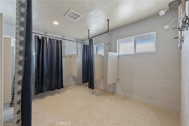 basement with a textured ceiling