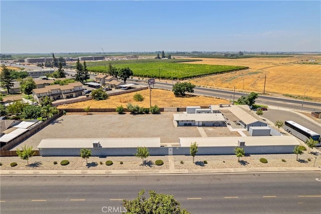 birds eye view of property with a rural view