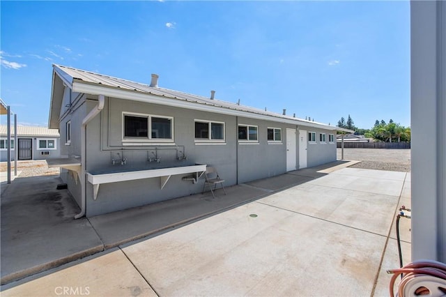 back of house featuring a patio area