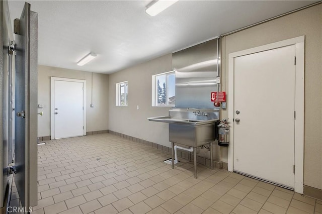 kitchen with light tile patterned flooring