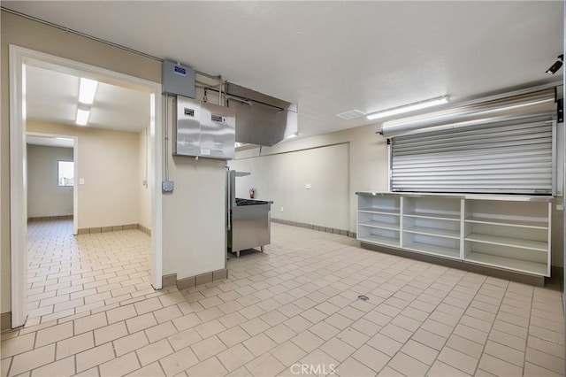 basement featuring light tile patterned flooring