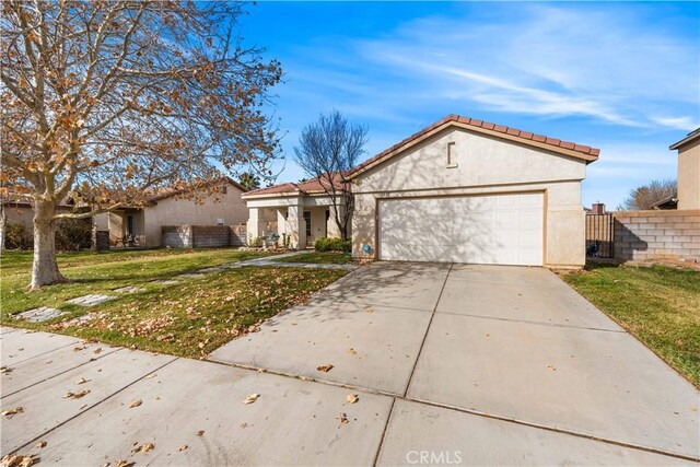 view of front of home with a front lawn and a garage