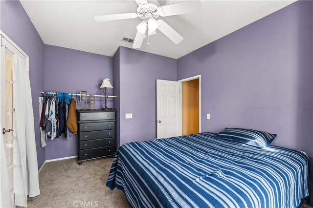 bedroom with ceiling fan and carpet