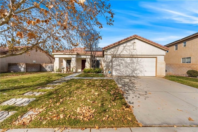 view of front of home featuring a garage and a front lawn