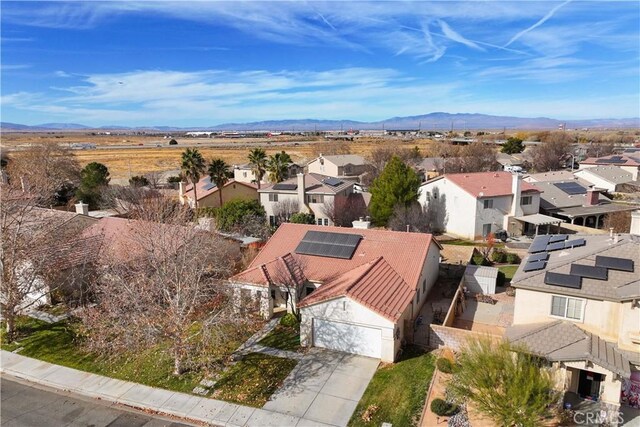 drone / aerial view featuring a mountain view