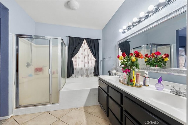 bathroom with plus walk in shower, tile patterned flooring, and vanity