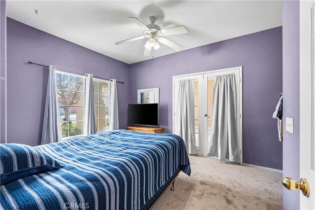 bedroom featuring ceiling fan and light colored carpet