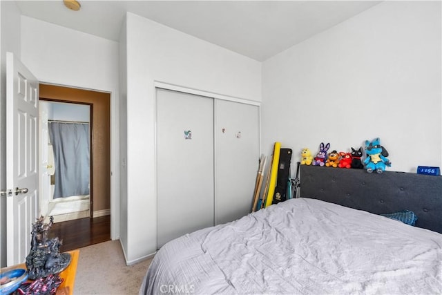 carpeted bedroom featuring a closet