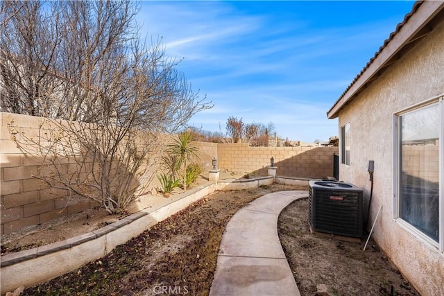 view of yard with central AC