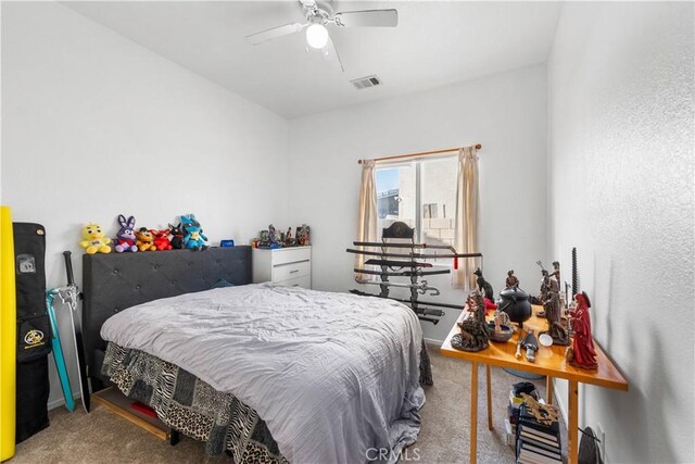 bedroom with ceiling fan and carpet flooring