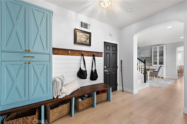 mudroom with light hardwood / wood-style flooring