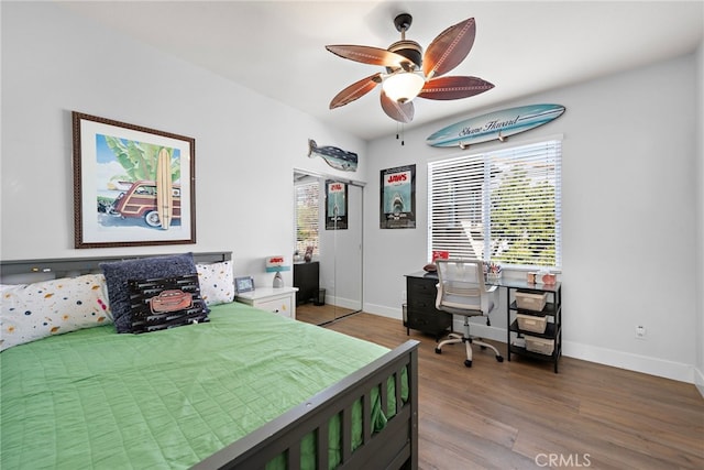 bedroom with ceiling fan and wood-type flooring