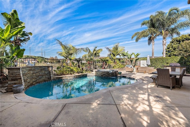 view of pool featuring an in ground hot tub and a patio