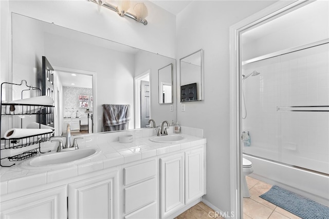 full bathroom with toilet, combined bath / shower with glass door, tile patterned floors, and vanity