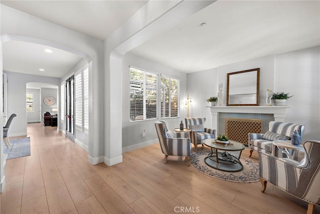 sitting room with light hardwood / wood-style flooring