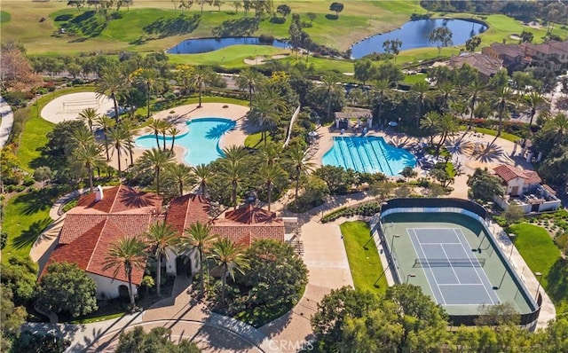 birds eye view of property with a water view