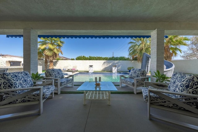 view of patio with an outdoor hangout area and a fenced in pool