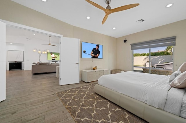 bedroom featuring ceiling fan and light hardwood / wood-style flooring