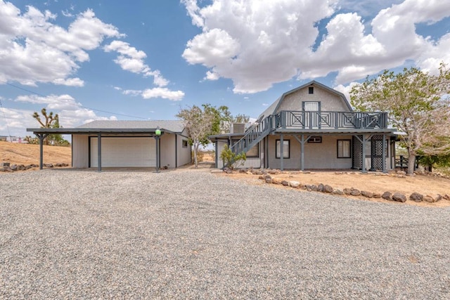 view of front of house with a garage and a wooden deck