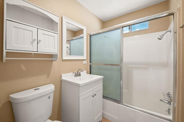 full bathroom with toilet, enclosed tub / shower combo, and vanity