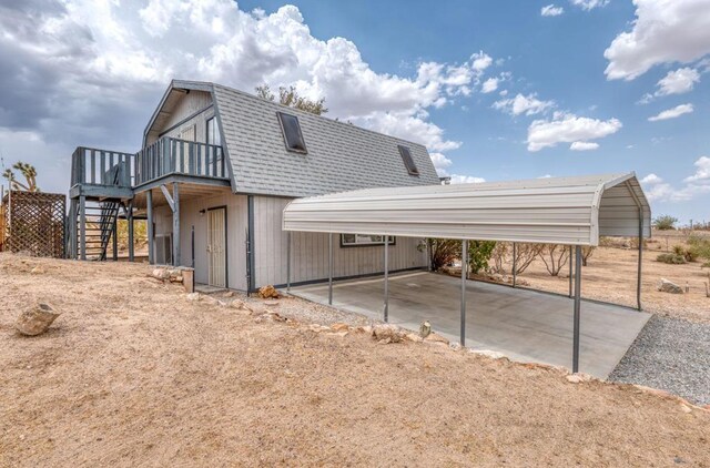 view of side of home featuring a carport