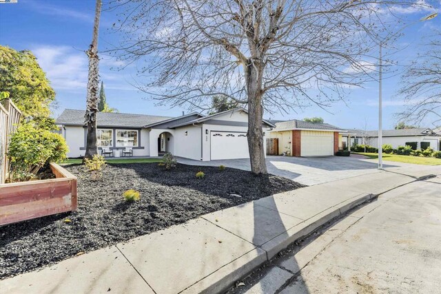 single story home featuring a garage