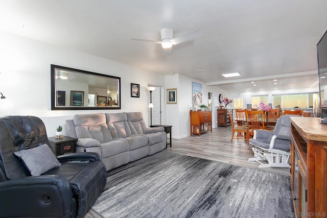 living room with ceiling fan and hardwood / wood-style floors