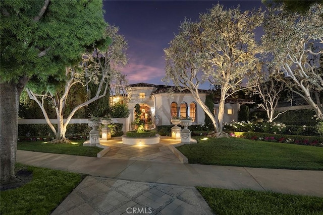 view of front of house with a lawn