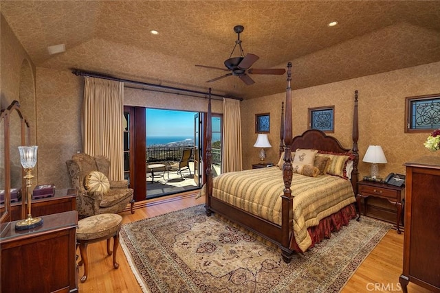 bedroom featuring ceiling fan, access to exterior, and wood-type flooring