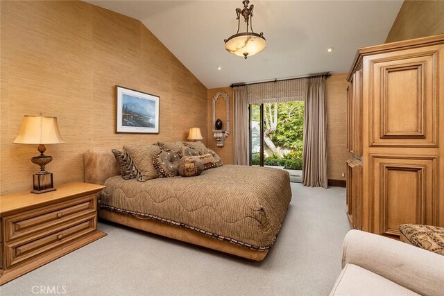 carpeted bedroom featuring lofted ceiling