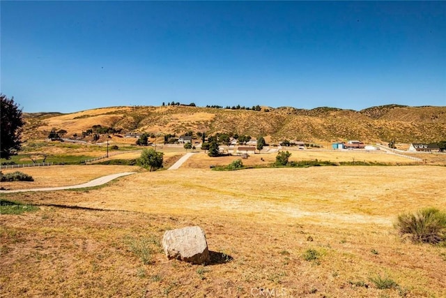 mountain view featuring a rural view