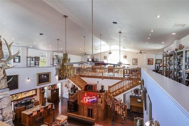 interior space featuring ceiling fan and vaulted ceiling