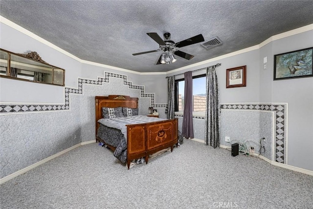 bedroom featuring ceiling fan, carpet flooring, a textured ceiling, and ornamental molding