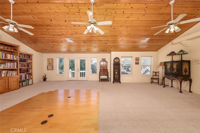 workout area featuring high vaulted ceiling, light colored carpet, and wood ceiling