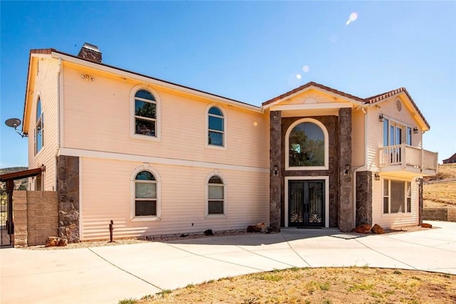 view of front of home with a balcony