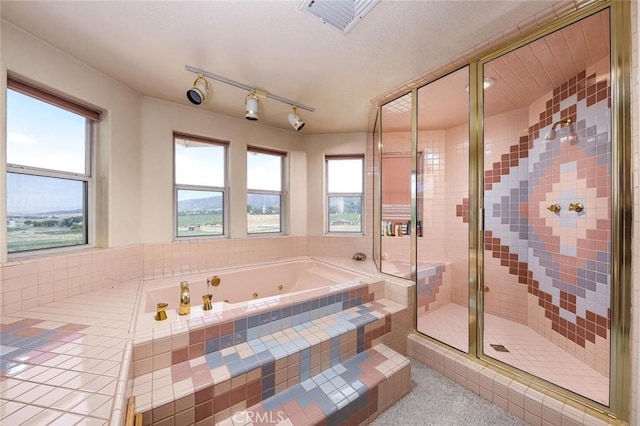 bathroom featuring plus walk in shower