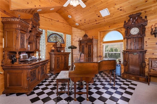 miscellaneous room featuring ceiling fan, wooden ceiling, lofted ceiling, and wooden walls