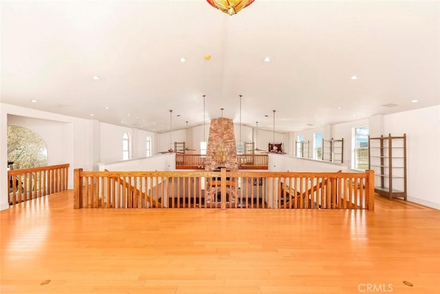 interior space with high vaulted ceiling and wood finished floors