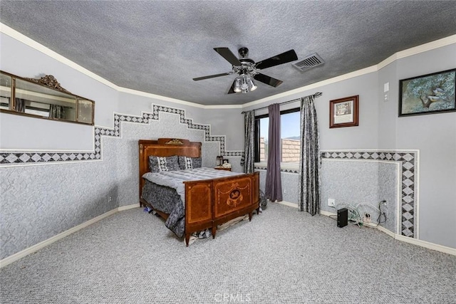 bedroom featuring carpet floors, visible vents, and a textured ceiling