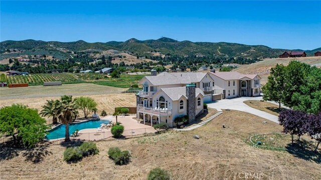 birds eye view of property featuring a mountain view