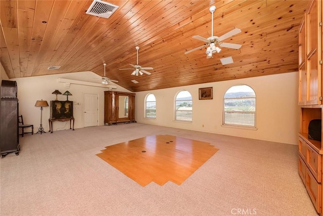 interior space featuring visible vents, a ceiling fan, light colored carpet, lofted ceiling, and wooden ceiling