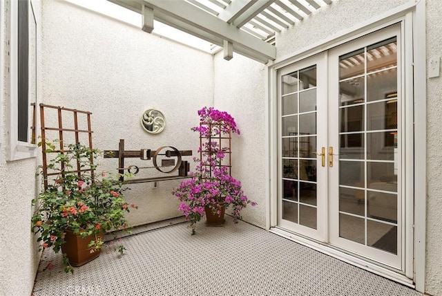 view of patio / terrace featuring french doors and a pergola