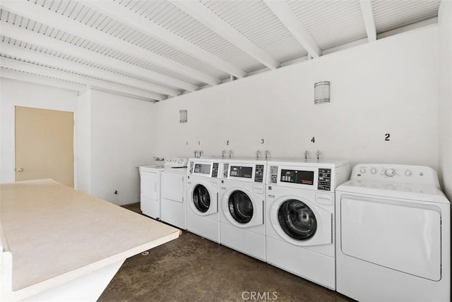 clothes washing area featuring separate washer and dryer