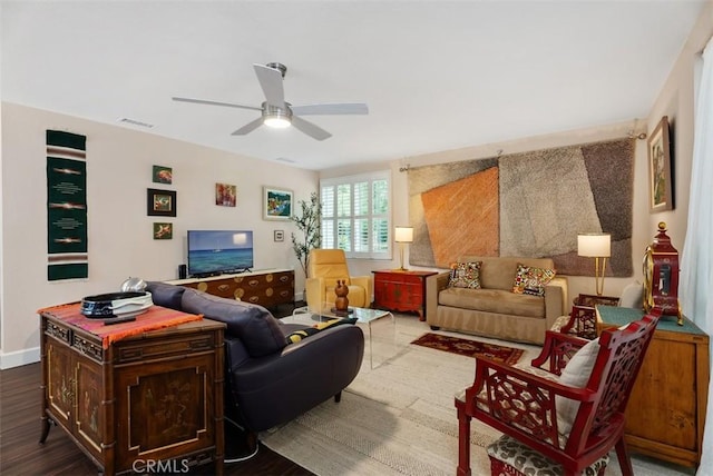 living room with ceiling fan and hardwood / wood-style floors