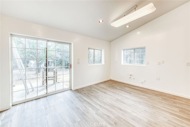 empty room with vaulted ceiling