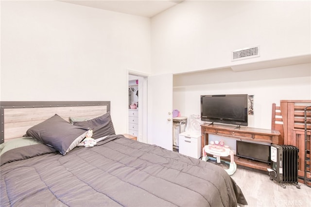 bedroom with light hardwood / wood-style flooring