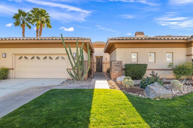 mediterranean / spanish home with a garage and a front lawn