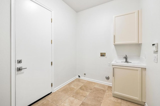 clothes washing area with cabinets, washer hookup, gas dryer hookup, and sink