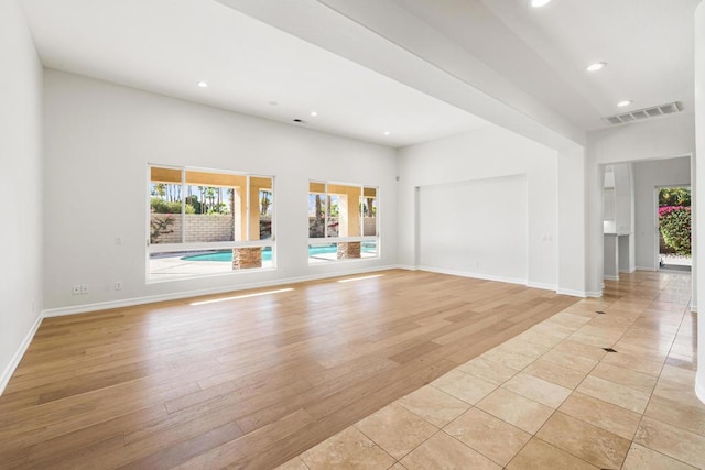 unfurnished living room with light wood-type flooring