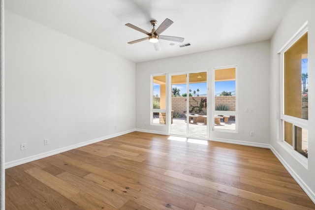 unfurnished room with ceiling fan and light hardwood / wood-style floors